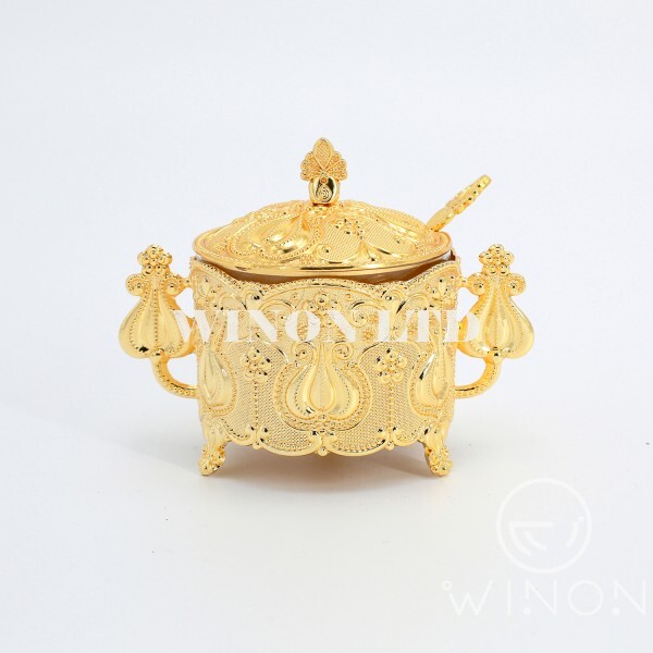golden plated round sugar pot with spoon